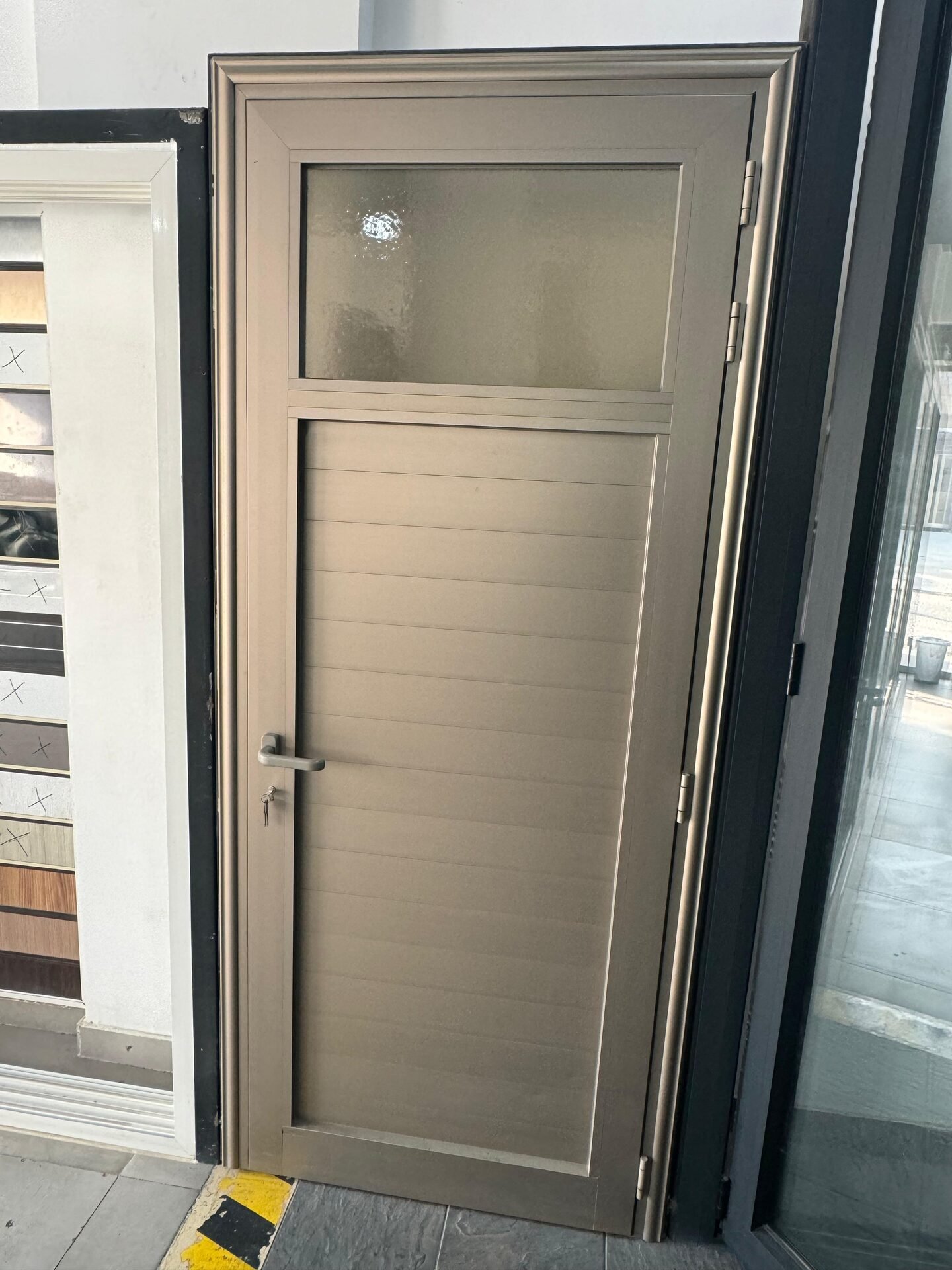 Champagne aluminium door with glazed side panel