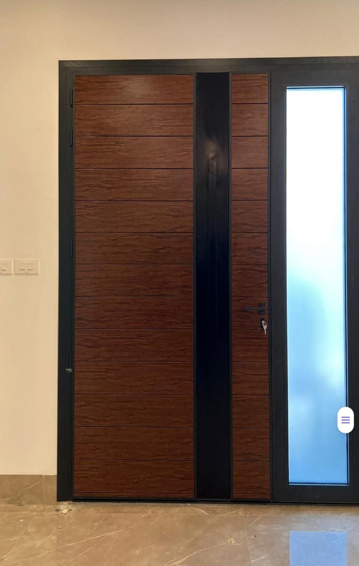 Wood-finish and black entrance door with glass sidelight