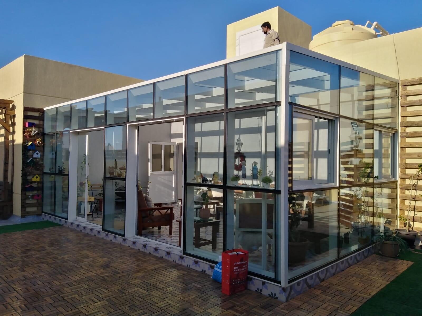 Rooftop glass room with aluminium framing